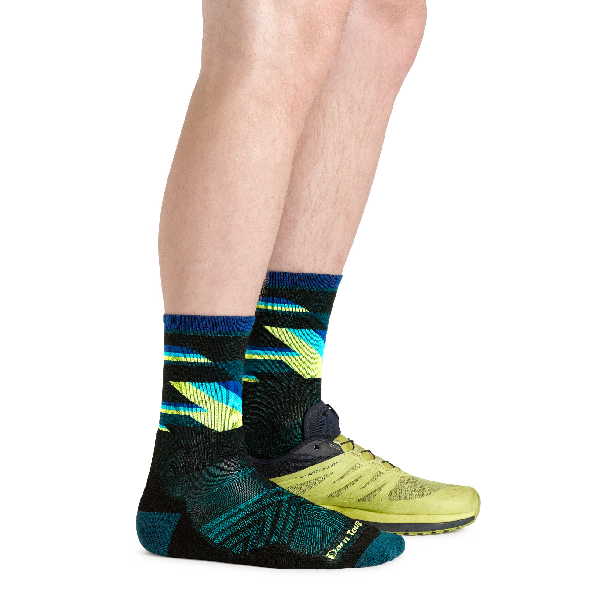 1056 men's bolt micro crew running socks in black on model wearing running sneaker on left foot