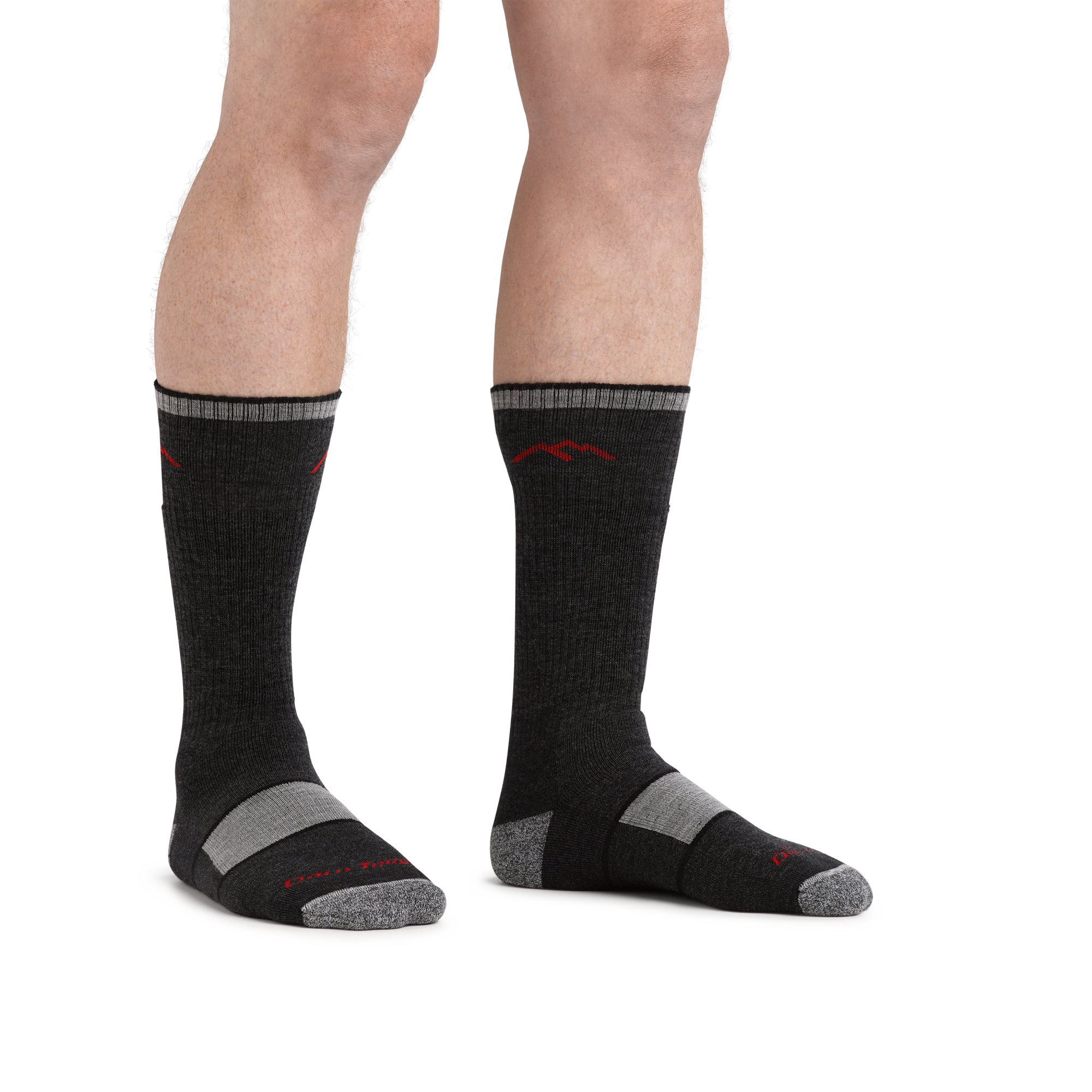 Close up image of man standing barefoot wearing Hiker Boot Midweight Hiking socks with Full Cushion in black
