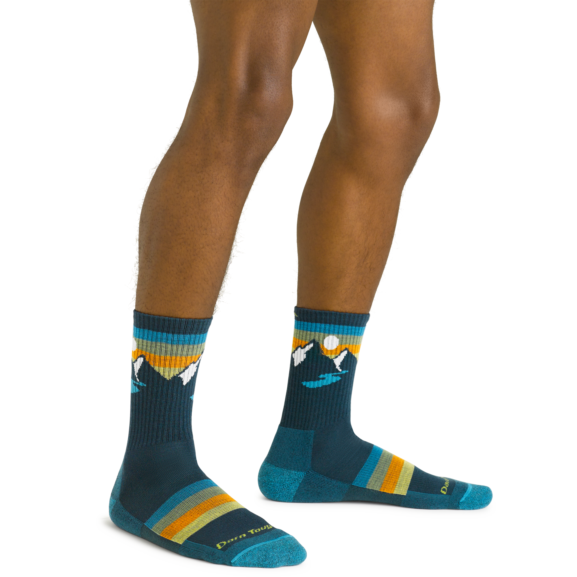 Close up shot of model wearing the men's sunset ridge micro crew hiking sock in bottle blue with no shoes on