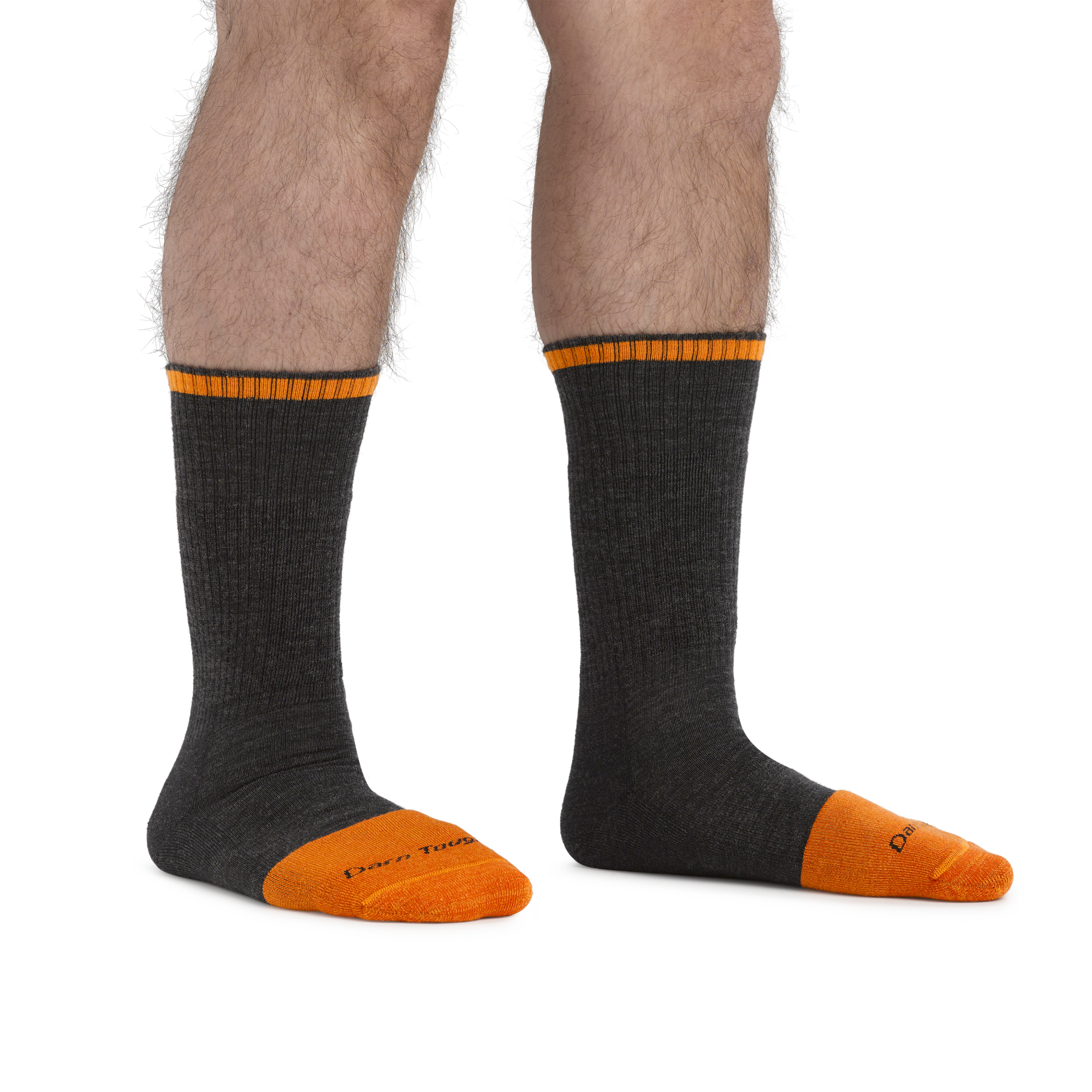 Man standing barefoot wearing Steely Boot Midweight Work Socks in Graphite