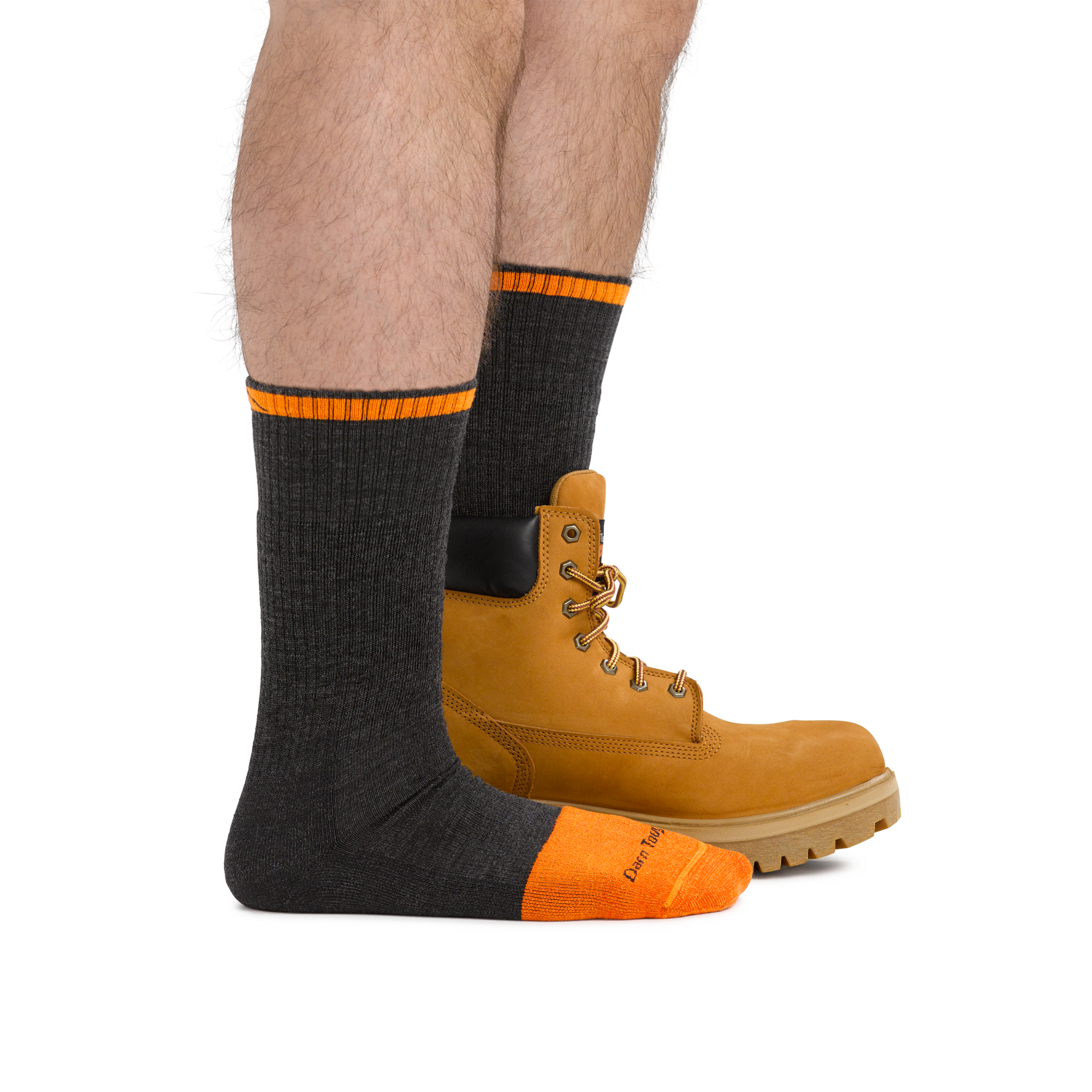 Man wearing Steely Boot Midweight Work Sock in Graphite, back foot also wearing a work boot