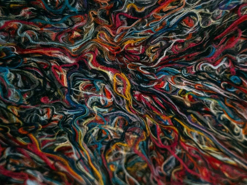 Merino Wool yarn fibers all gathered together, showing the different colors