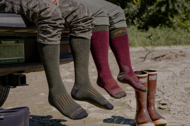 Shop Hunting Socks - two pairs of feet wearing warm wool hunt socks