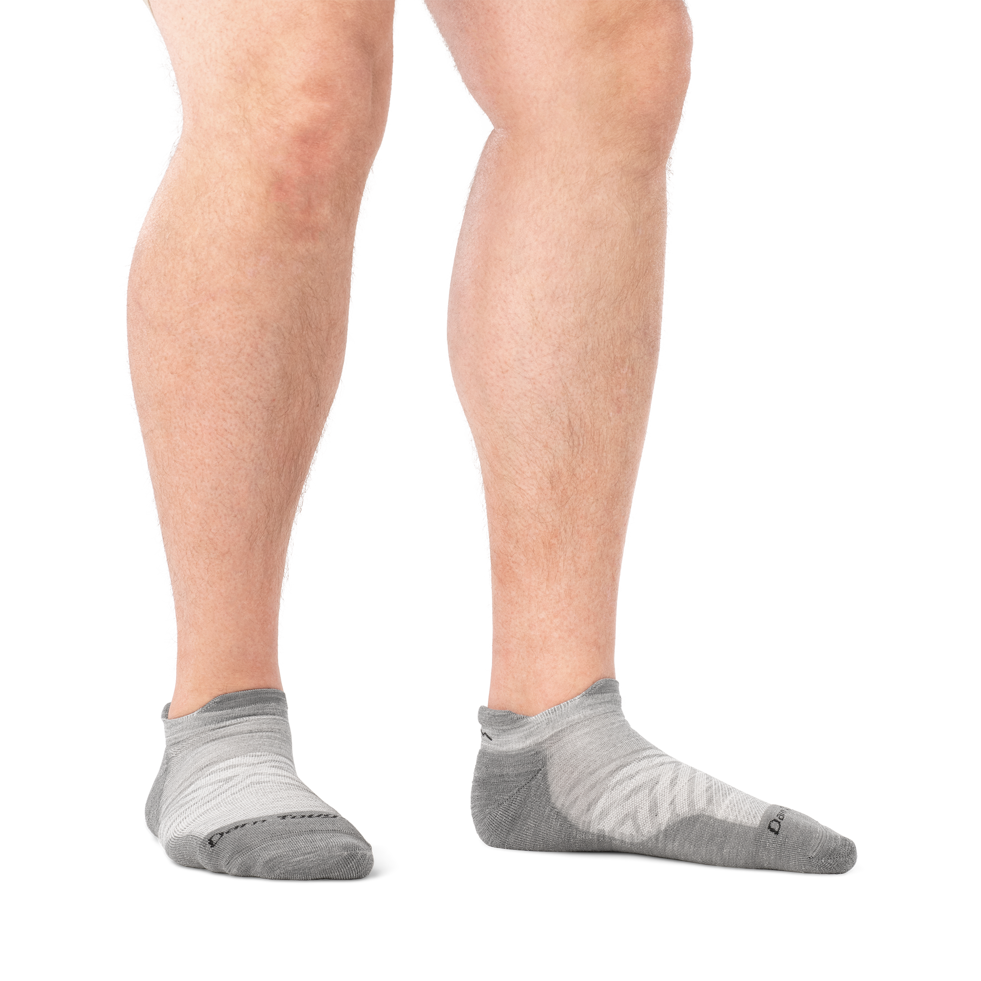 on model image of man barefoot wearing 1039 gray run no show tab ultra lightweight with cushion sock