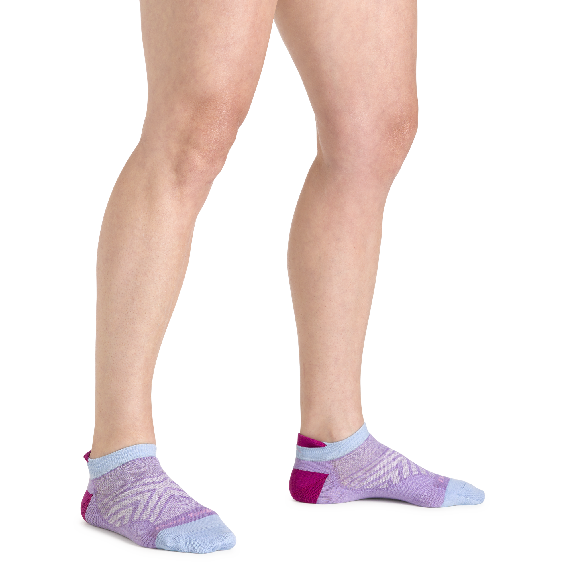 Close up shot of model wearing the women's no show tab running sock in lavender with no shoes on