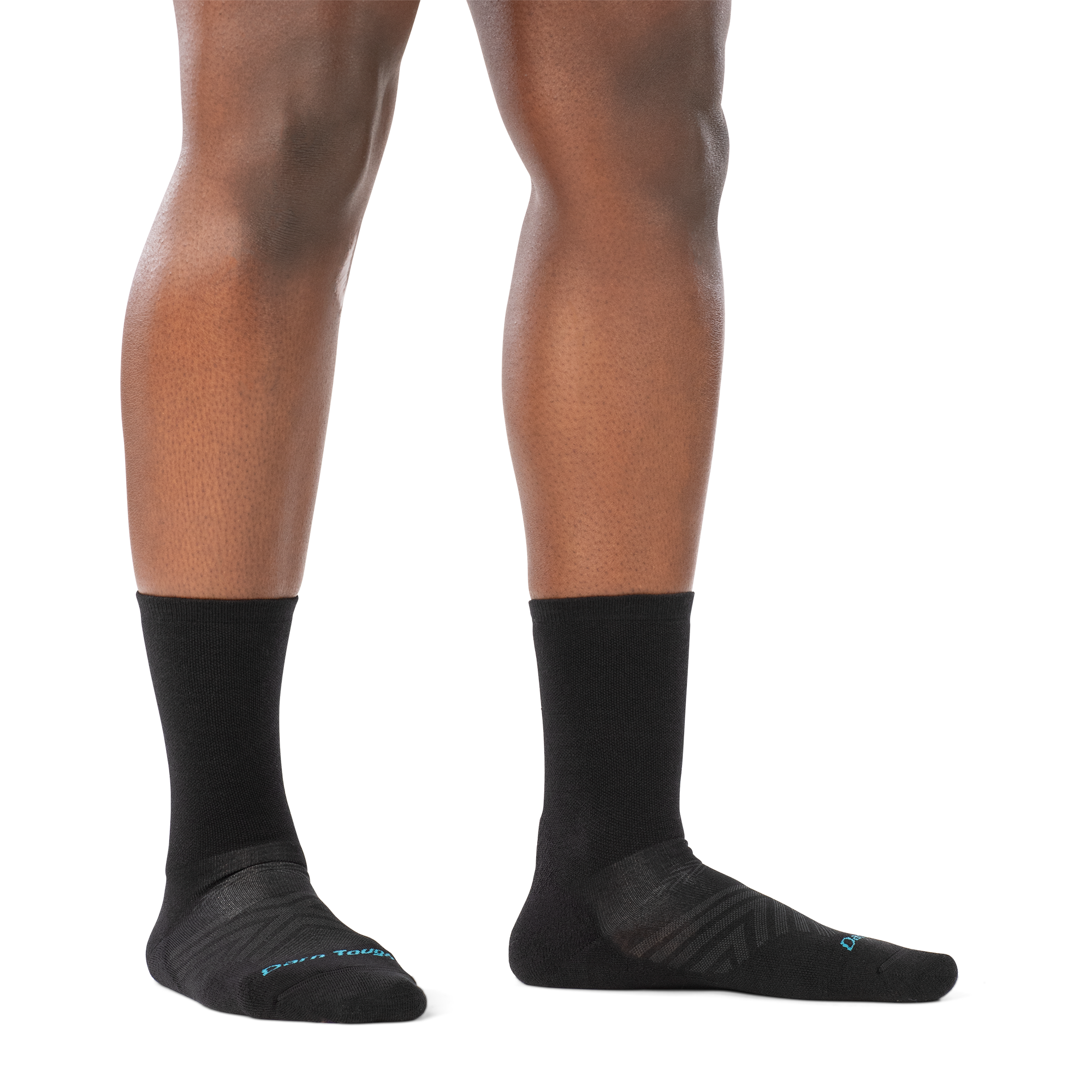 on model image of woman barefoot in staggered stance wearing 1072 black run micro crew ultra lightweight with cushion sock