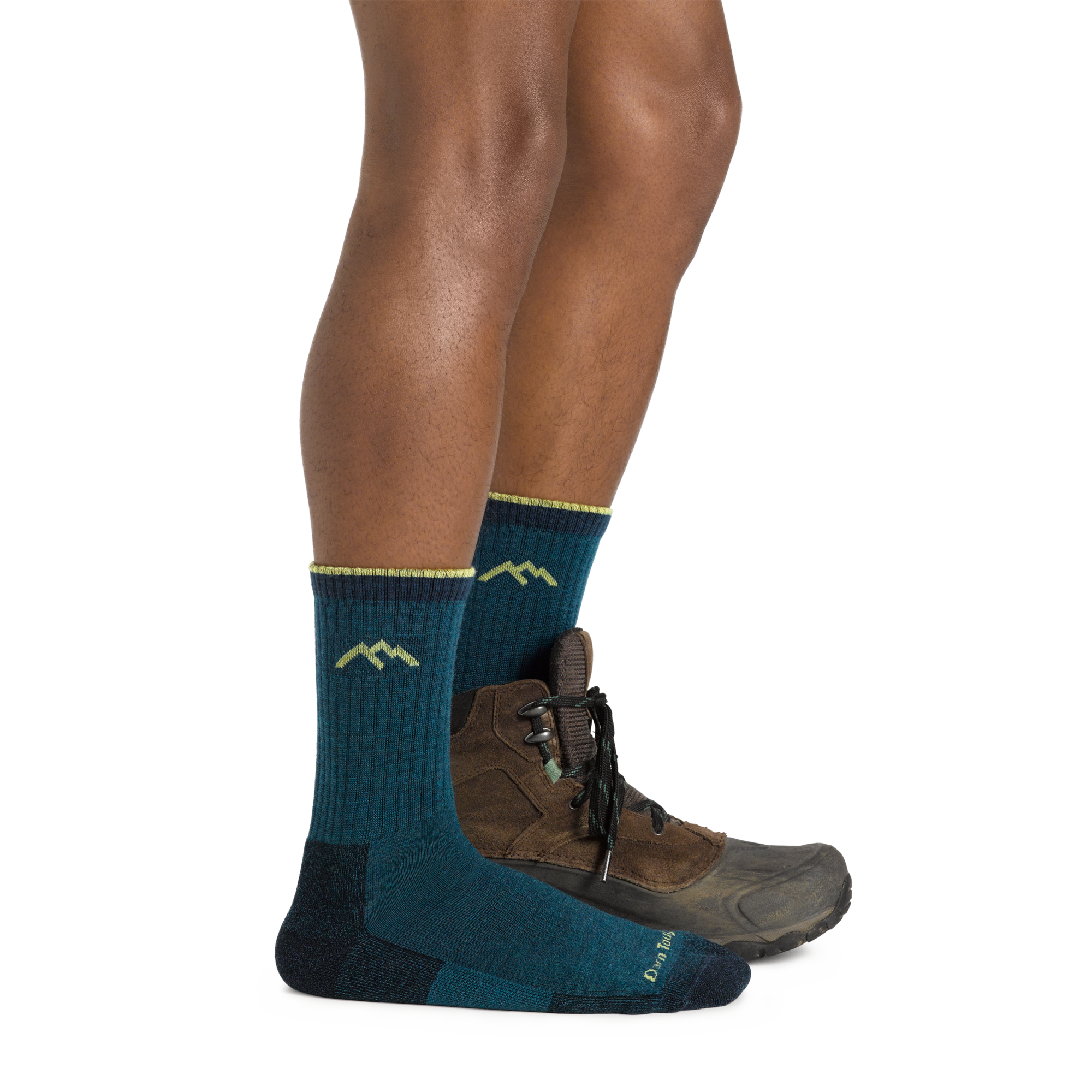 Profile of male legs facing to the right, front foot wearing Hiker Micro Crew Midweight Hiking Sock in Dark Teal, foot in back also wearing a hiking shoe