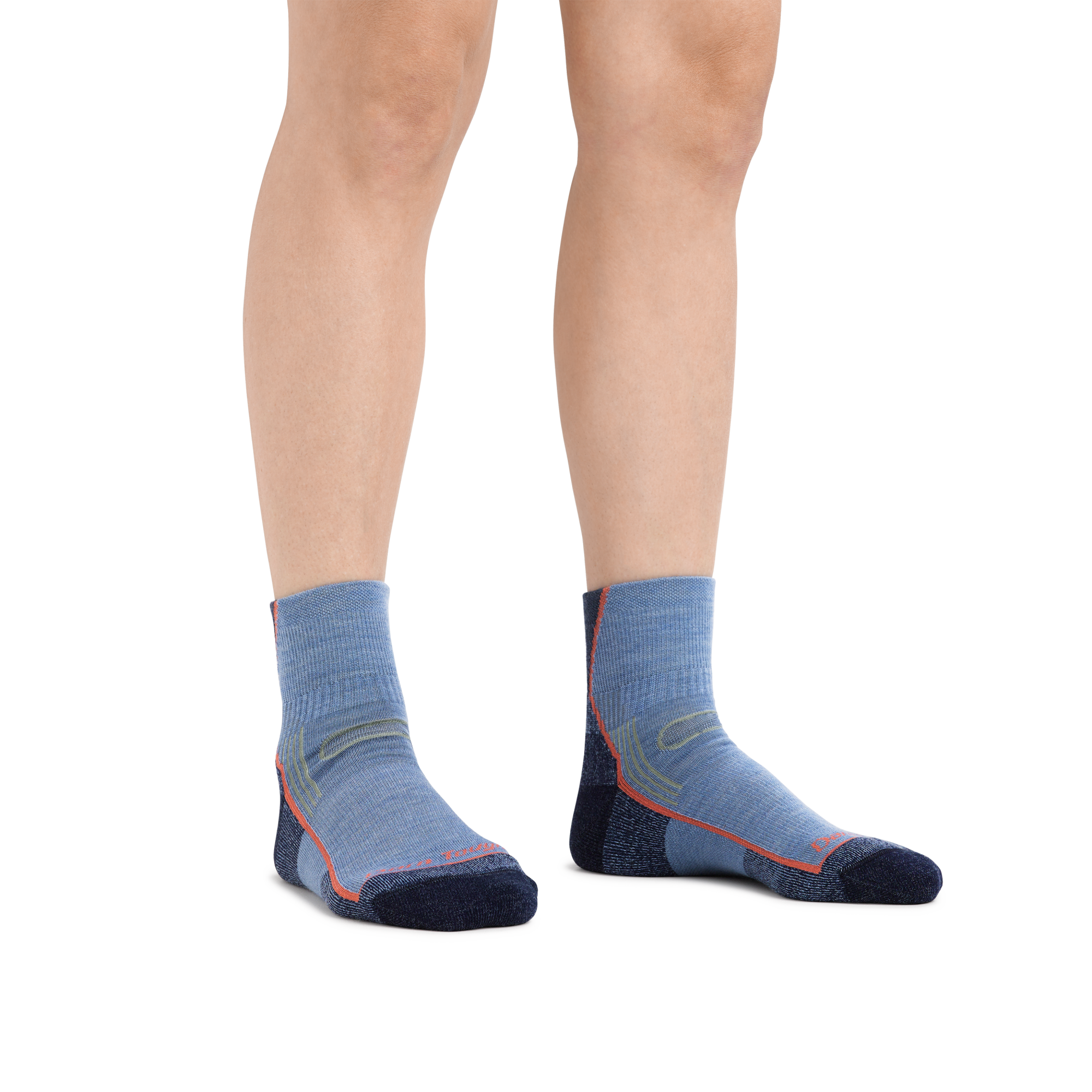 Woman's legs standing on a white background wearing Women's Hiker Quarter Midweight Hiking Socks in Denim Heather