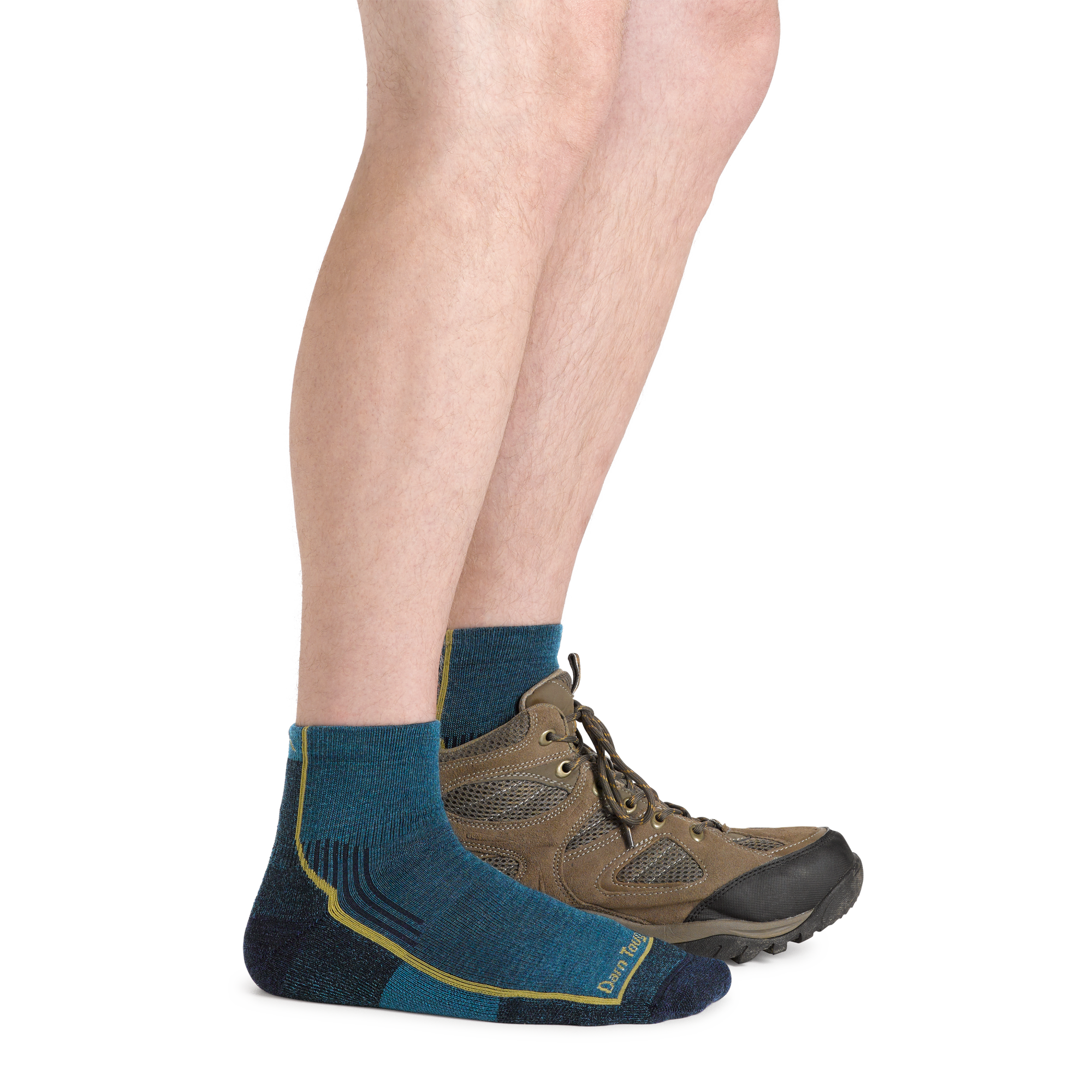 Model wearing Men's Hiker Quarter Midweight Hiking Socks in dark teal and a hiking boot on one foot