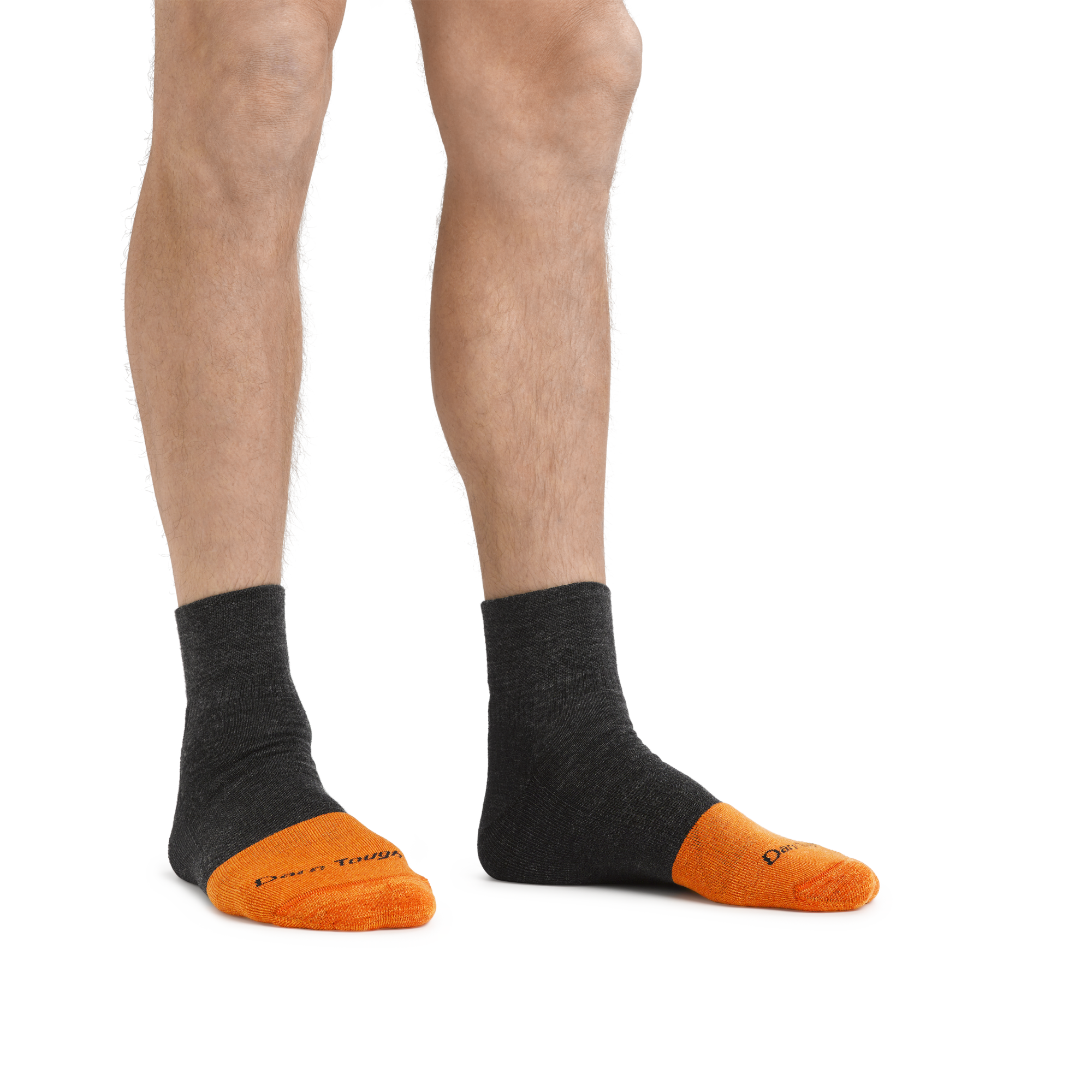 Man standing barefoot wearing Steely Quarter Midweight Work socks in Graphite