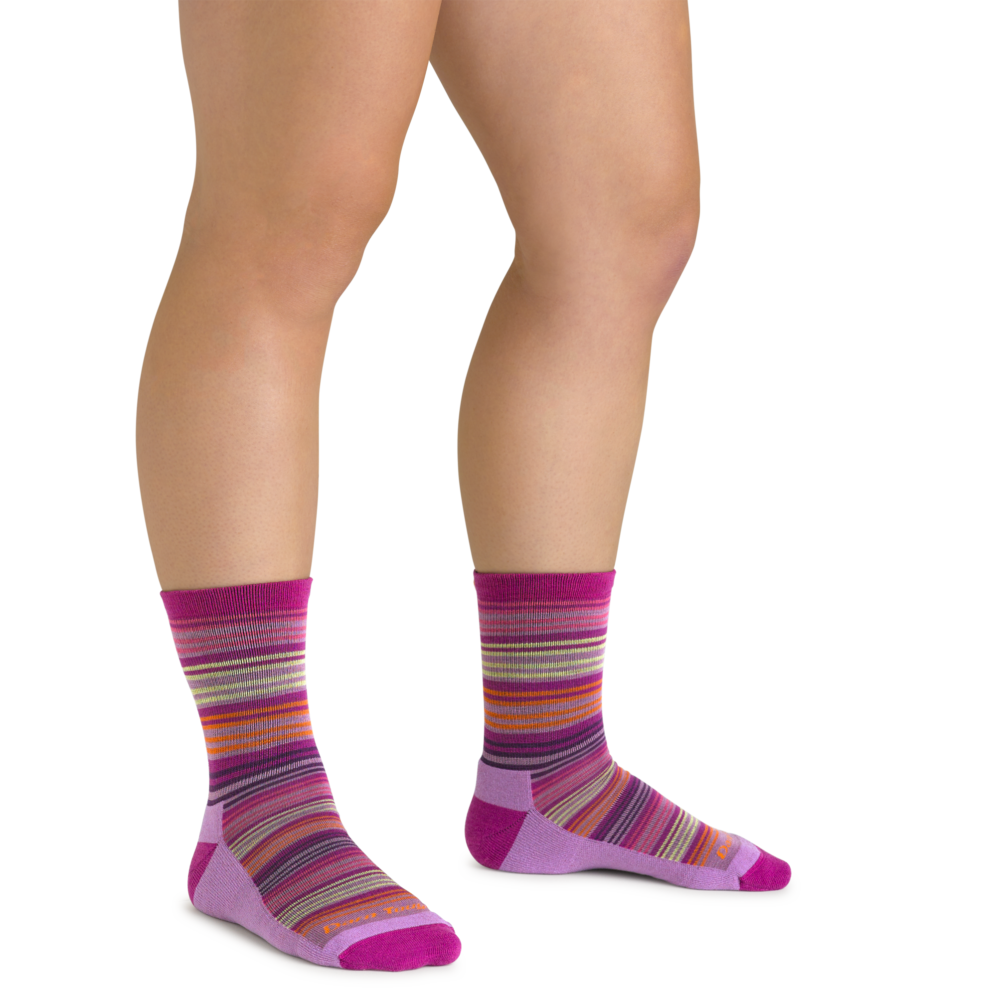 Close up shot of model wearing the kids zebra canyon micro crew hiking socks in clover pink with no shoes on