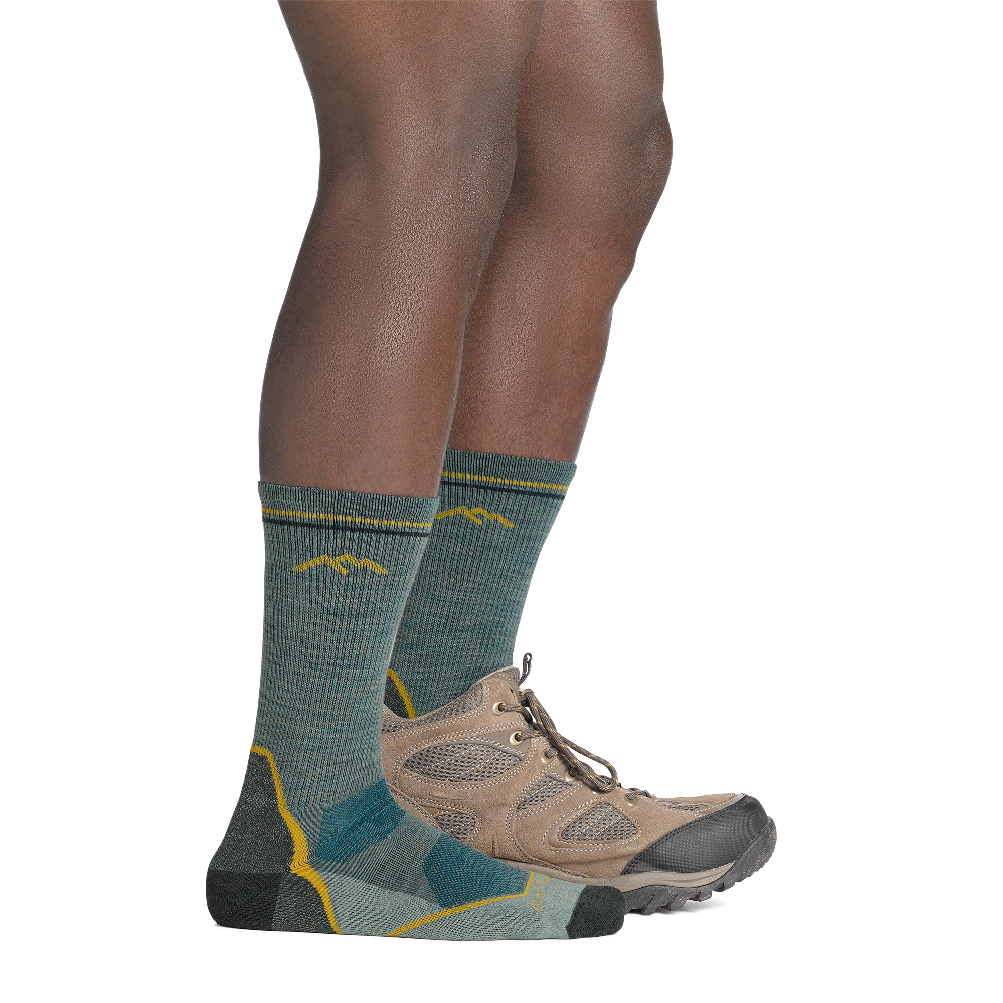 on model image with back foot in hiking shoe wearing the 5028 light hiker boot sock in seafoam green colorway