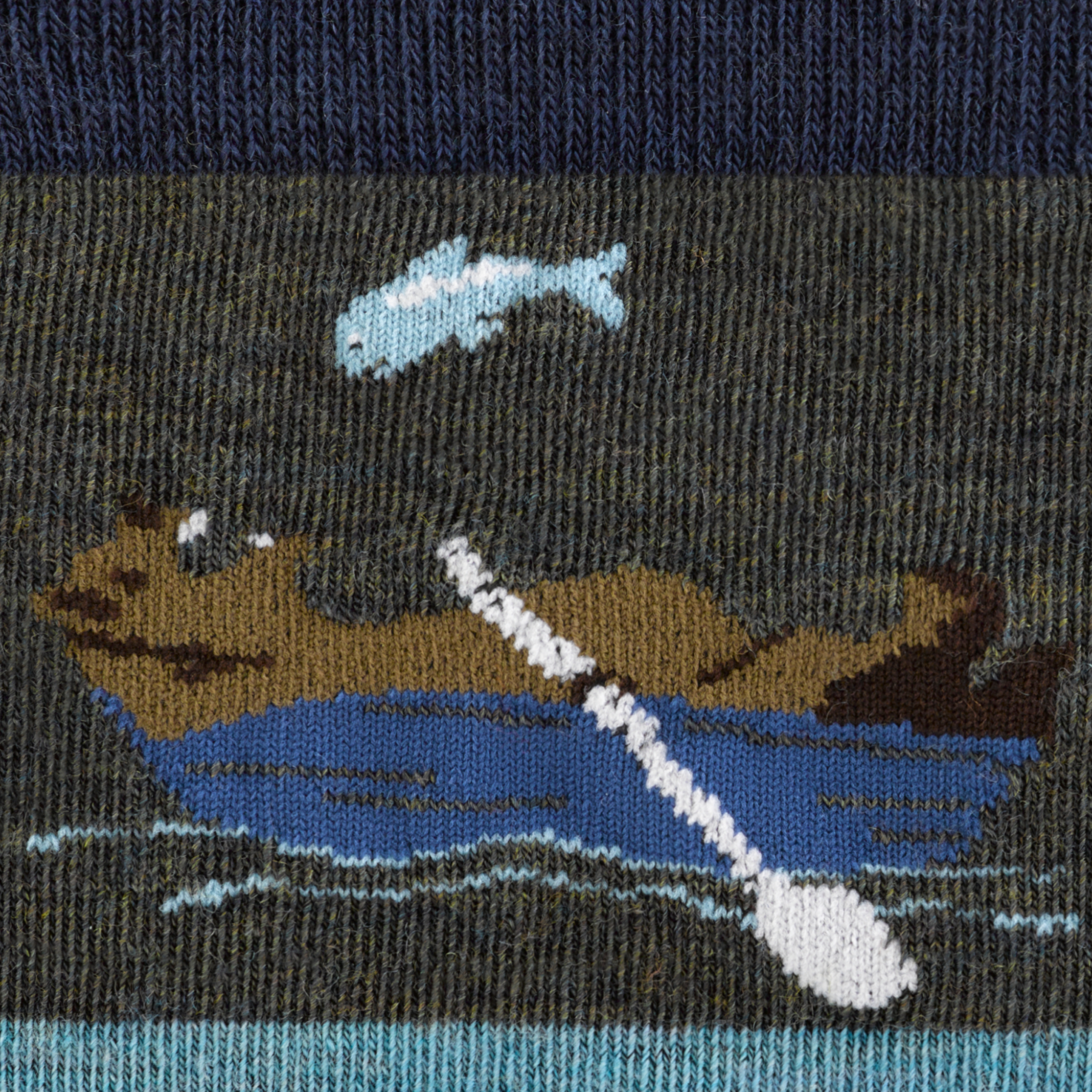 Call out detail image of the of the 6066 forest reverse image of bear laying in boat ready to catch fish