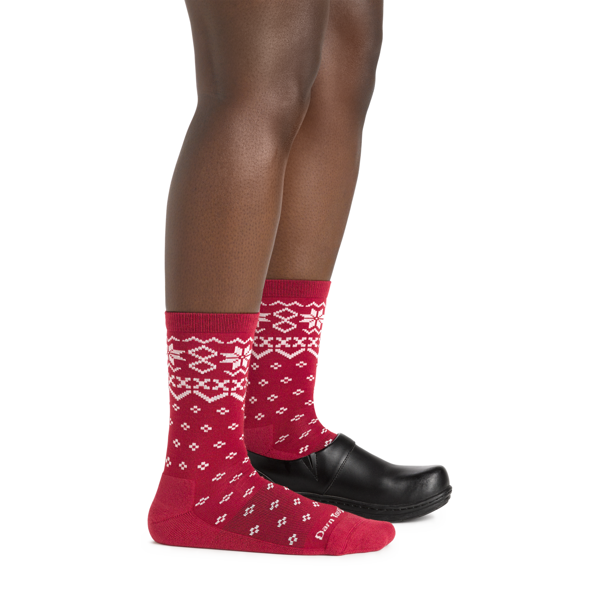 Side studio shot of model wearing women's shetland crew lightweight lifestyle sock in cranberry with black show on left foot