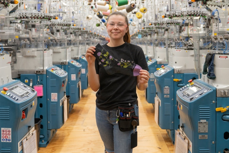 Alissa holding up her favorite, the blossom sock with clover flowers