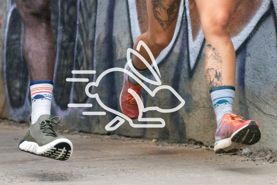Speedy rabbit icon overlaid on image of darn tough running socks