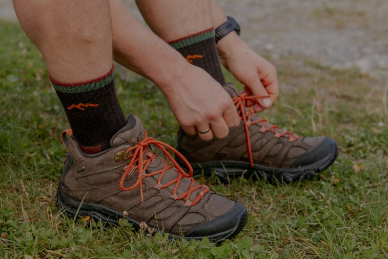 Shop Sock Gifts for Him - feet wearing hiking boots and hiking socks, great gift ideas