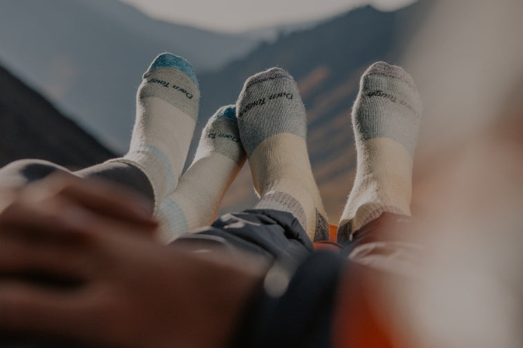 Shop Warm Socks - feet wearing super warm cozy socks from Darn Tough