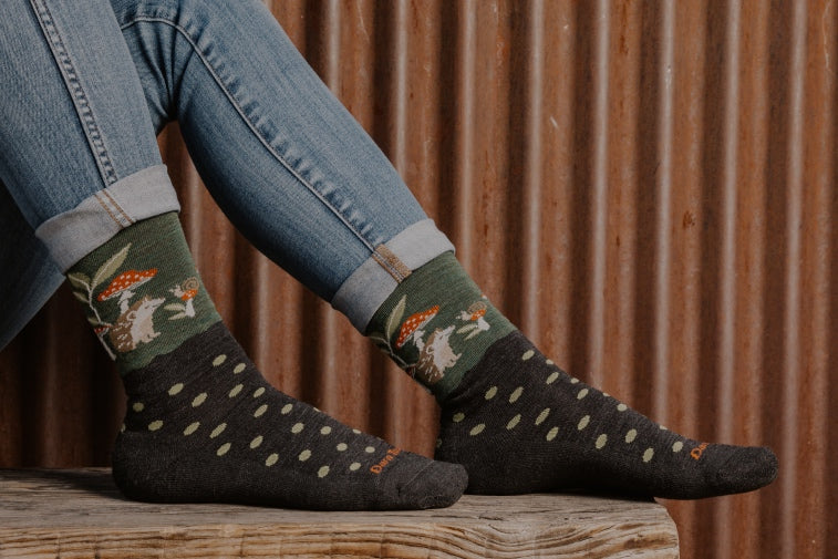 Shop New Socks - feet wearing polka dot socks with hedgehogs on them