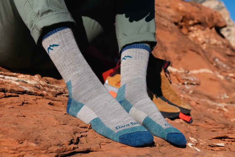 Shop Hiking gift ideas - feet wearing hiking socks in grey and blue